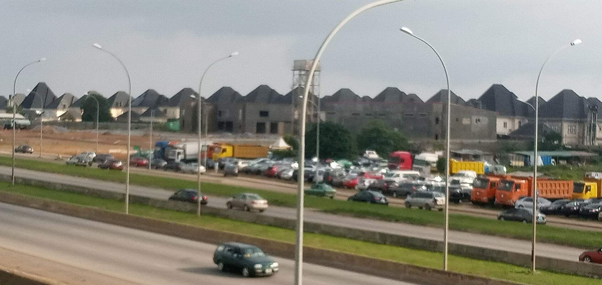 Rows of houses on a housing estate in Karsana, Abuja, seen from the expressway